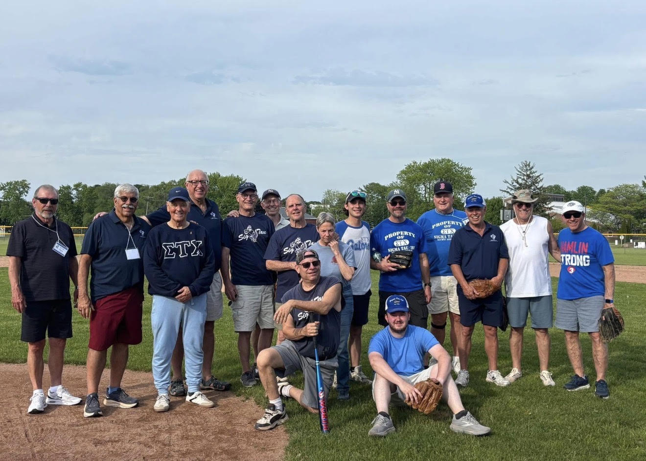 Greg Clark with Sigma Tau Chi alumni at a Fort Ontario fundraiser benefiting Oswego Little League.
