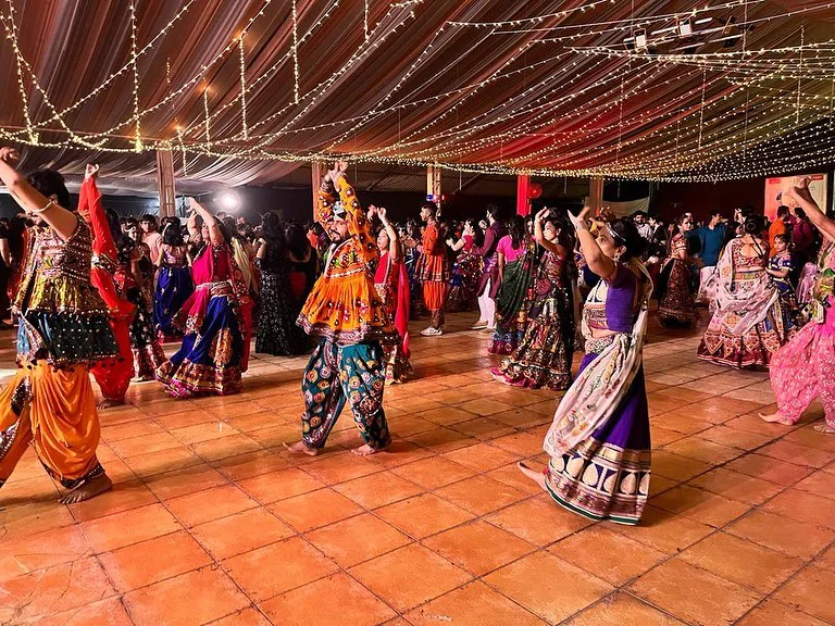 Dandiya night under a red and green decorated tent