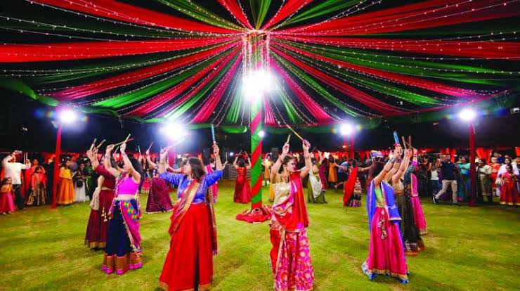 Dancer in blue lehenga performing Garba