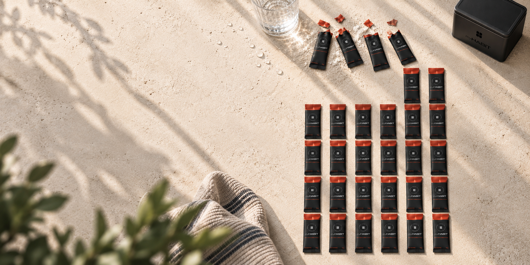 myHABIT sachets arranged on a light stone surface