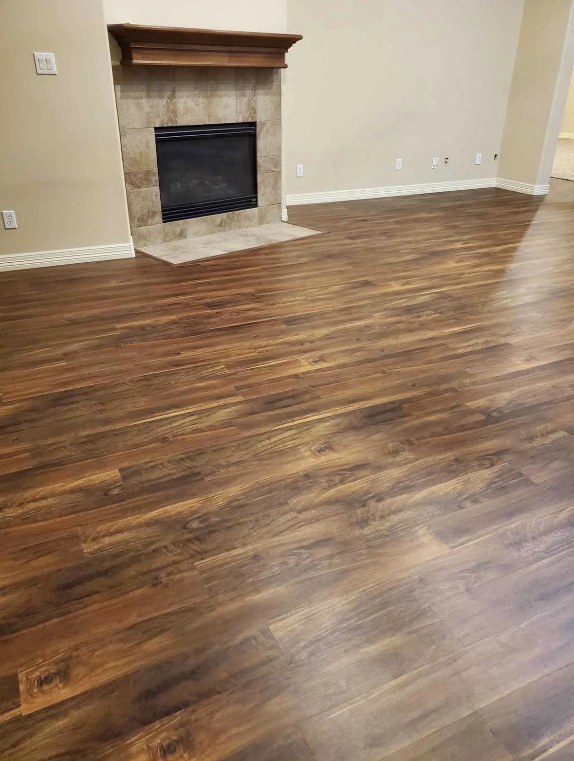 M&L Exterior and Interior Design — Espresso LVP Living Room before and after