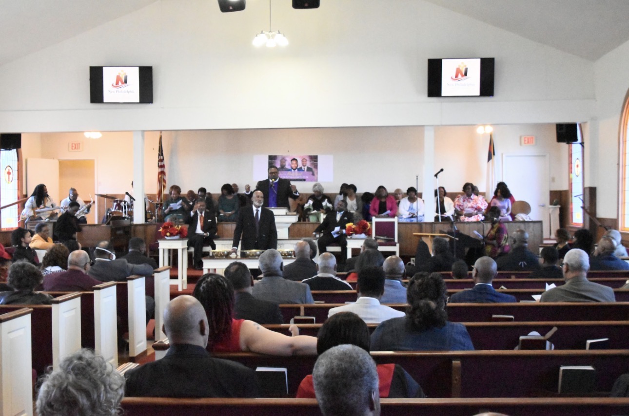 Congregation standing in worship at New Philadelphia