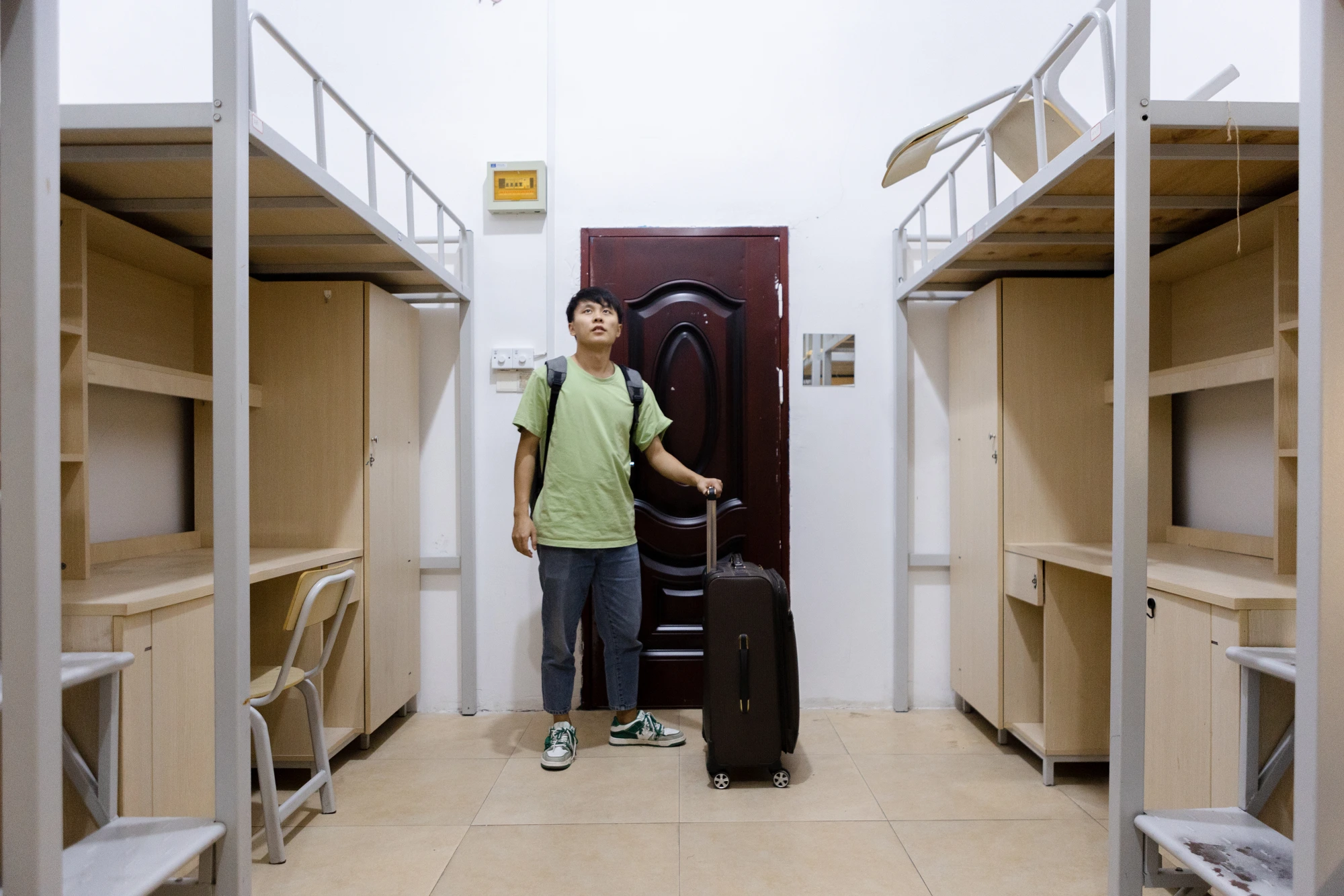 A freshman arriving at their dorm on move-in day