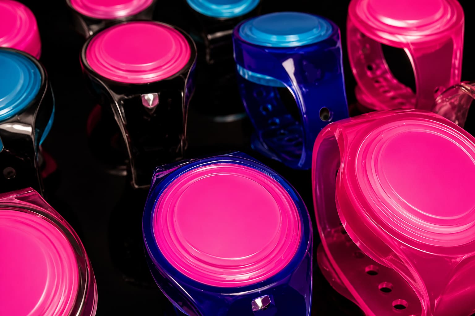 A converging lineup of colorful WearSpray wearables with a glowing pink center face