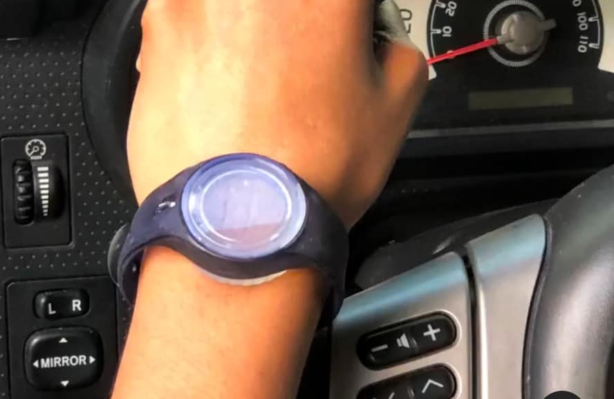 A WearSpray band worn while driving