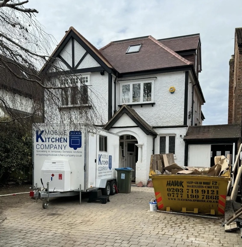 Mobile kitchen trailer delivered to a customer's driveway during a full kitchen renovation