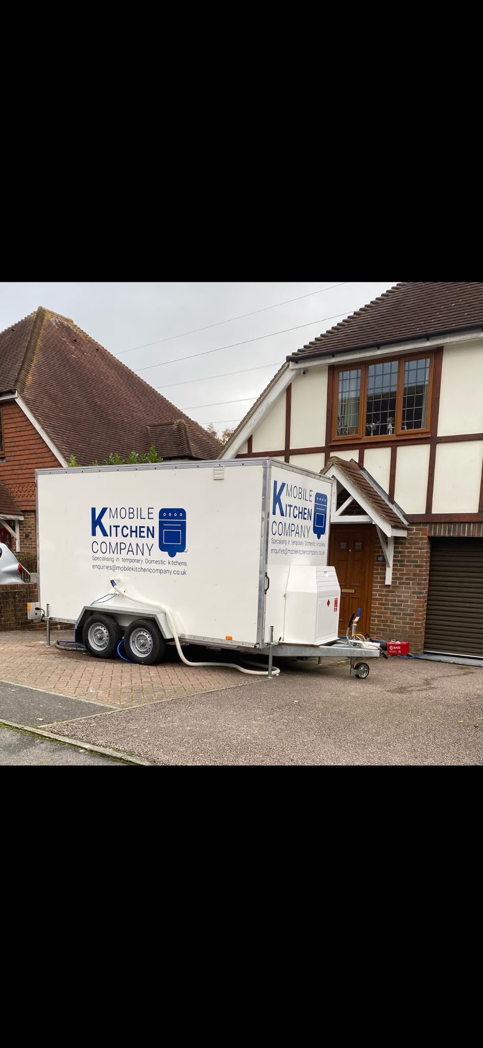 Mobile kitchen trailer on site at a customer's home